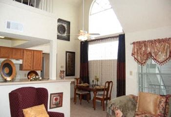 a living room with a couch a chair and a table